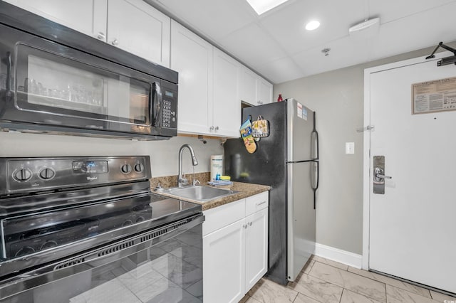 6900 N Ocean Blvd Unit 201, Myrtle Beach, SC 29572 - kitchen featuring black appliances, white cabinets, and light marble finish floors