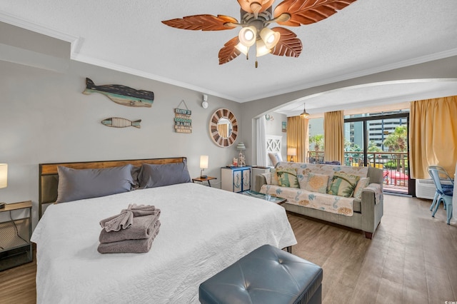 6900 N Ocean Blvd Unit 201, Myrtle Beach, SC 29572 - bedroom featuring access to outside, arched walkways, wood finished floors, crown molding, and ceiling fan