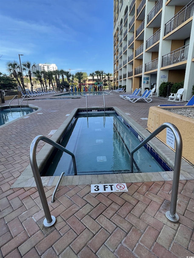 6900 N Ocean Blvd Unit 201, Myrtle Beach, SC 29572 - community pool with a patio area