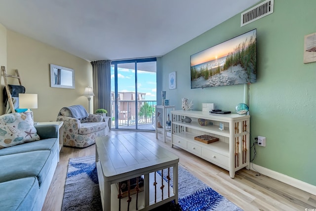 9550 Shore Dr Unit 225, Myrtle Beach, SC 29572 - living area featuring light wood-type flooring and floor to ceiling windows
