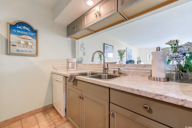 9550 Shore Dr Unit 225, Myrtle Beach, SC 29572 - kitchen featuring white dishwasher, light tile patterned flooring, and light stone countertops