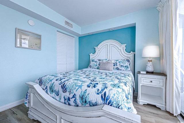 9550 Shore Dr Unit 225, Myrtle Beach, SC 29572 - bedroom featuring wood finished floors