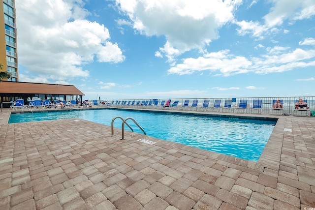 9550 Shore Dr Unit 225, Myrtle Beach, SC 29572 - community pool with a patio area