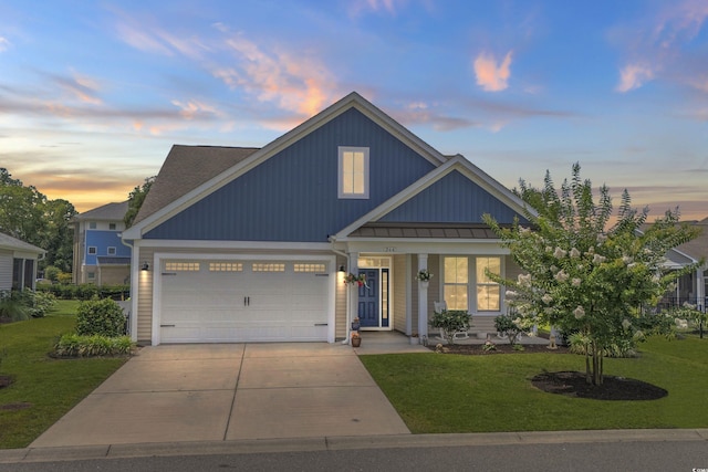 264 Switchgrass Loop, Little River, SC 29566 - view of front facade featuring concrete driveway, a lawn, a garage, and a porch
