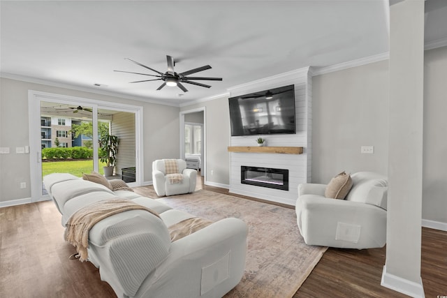 264 Switchgrass Loop, Little River, SC 29566 - living area featuring a ceiling fan, wood finished floors, ornamental molding, and a fireplace