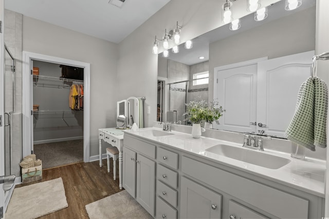 264 Switchgrass Loop, Little River, SC 29566 - full bathroom with a stall shower, double vanity, a spacious closet, and wood finished floors