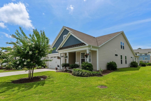 264 Switchgrass Loop, Little River, SC 29566 - craftsman-style house featuring driveway, a front yard, an attached garage, board and batten siding, and covered porch