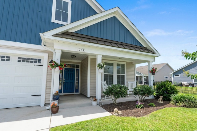 264 Switchgrass Loop, Little River, SC 29566 - view of front of house with board and batten siding, a metal roof, a porch, and a standing seam roof