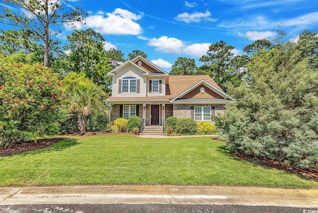 128 Knotty Pine Way, Murrells Inlet, SC 29576 - traditional home with a front yard and stone siding