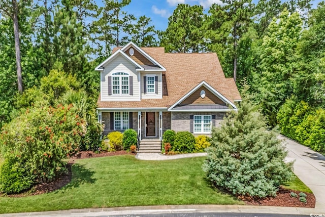 128 Knotty Pine Way, Murrells Inlet, SC 29576 - traditional home with a front lawn and a porch