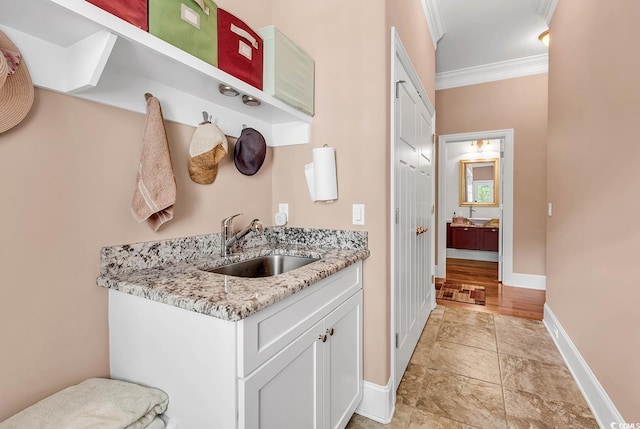 128 Knotty Pine Way, Murrells Inlet, SC 29576 - kitchen featuring crown molding, light stone finish flooring, light stone counters, and white cabinetry