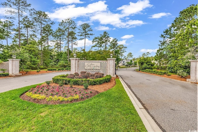 128 Knotty Pine Way, Murrells Inlet, SC 29576 - community sign featuring a gate and driveway