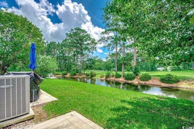 456 Colonial Trace Dr Unit 13-E, Longs, SC 29568 - view of grassy yard with a water view and view of wooded area