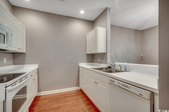 456 Colonial Trace Dr Unit 13-E, Longs, SC 29568 - kitchen featuring white appliances, light wood-style floors, white cabinets, light countertops, and recessed lighting