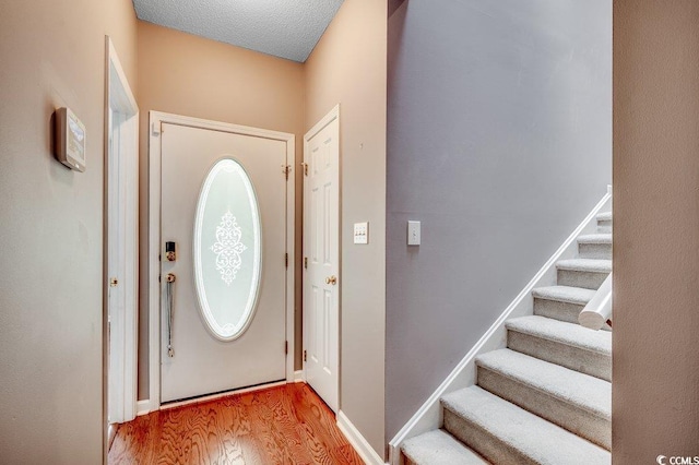 456 Colonial Trace Dr Unit 13-E, Longs, SC 29568 - foyer entrance with wood finished floors and stairs