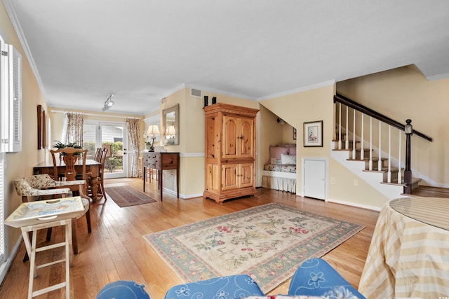 315 72nd Ave N Unit A, Myrtle Beach, SC 29572 - living room with stairway, wood finished floors, and ornamental molding