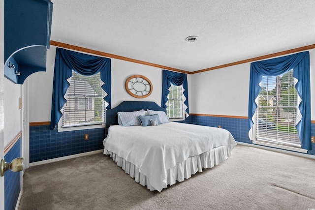 315 72nd Ave N Unit A, Myrtle Beach, SC 29572 - carpeted bedroom with multiple windows, wainscoting, a textured ceiling, and ornamental molding