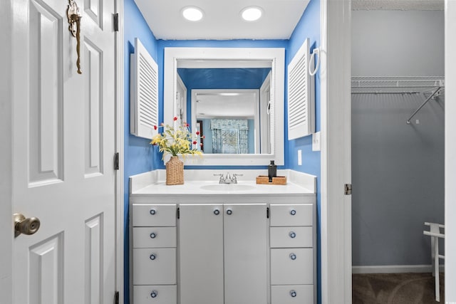 315 72nd Ave N Unit A, Myrtle Beach, SC 29572 - bathroom with vanity and a spacious closet