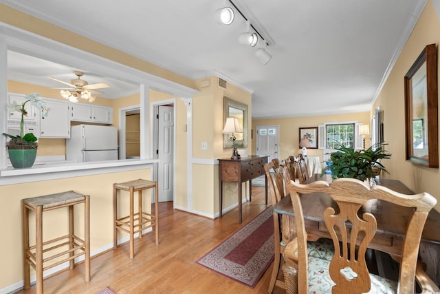 315 72nd Ave N Unit A, Myrtle Beach, SC 29572 - dining area featuring light wood-style floors, ornamental molding, and a ceiling fan