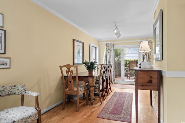 315 72nd Ave N Unit A, Myrtle Beach, SC 29572 - dining area featuring light wood-style floors and crown molding