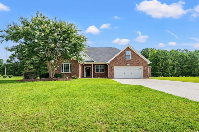 307 Russ Rd, Loris, SC 29569 - view of front of home featuring a garage, driveway, and a front lawn