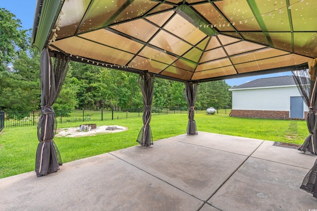 307 Russ Rd, Loris, SC 29569 - fenced backyard with a gazebo, an outdoor fire pit, and a patio area
