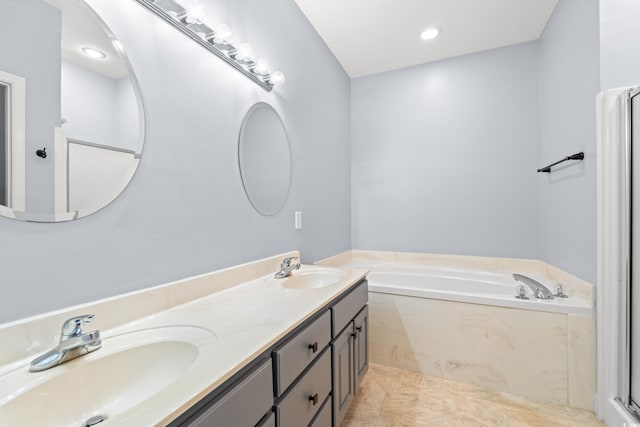 307 Russ Rd, Loris, SC 29569 - bathroom with a garden tub and double vanity
