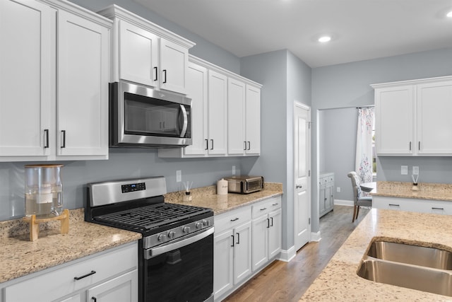 226 Calhoun Falls Dr, Myrtle Beach, SC 29579 - kitchen featuring stainless steel appliances, light wood-style flooring, white cabinets, and recessed lighting