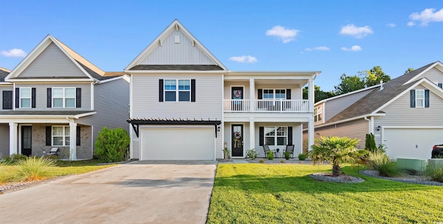 226 Calhoun Falls Dr, Myrtle Beach, SC 29579 - view of front facade featuring a balcony, concrete driveway, board and batten siding, a front yard, and a garage