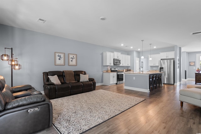 226 Calhoun Falls Dr, Myrtle Beach, SC 29579 - living area featuring dark wood-style flooring and recessed lighting