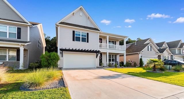 226 Calhoun Falls Dr, Myrtle Beach, SC 29579 - traditional-style home with board and batten siding, concrete driveway, an attached garage, a front lawn, and a balcony