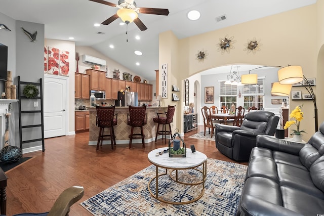 908 Ashbourn Ct, Murrells Inlet, SC 29576 - living room featuring arched walkways, ceiling fan, high vaulted ceiling, a wall unit AC, and dark wood finished floors