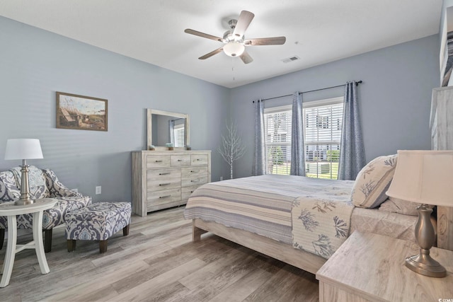 314 Black Oak Ln Unit 102, Murrells Inlet, SC 29576 - bedroom featuring light wood-style flooring and a ceiling fan