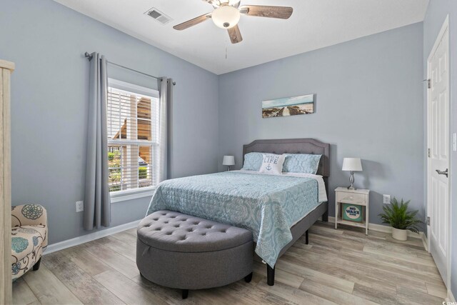 314 Black Oak Ln Unit 102, Murrells Inlet, SC 29576 - bedroom with light wood-type flooring and a ceiling fan