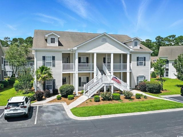 314 Black Oak Ln Unit 102, Murrells Inlet, SC 29576 - view of property with stairway and uncovered parking