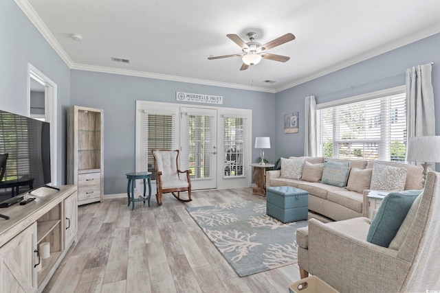314 Black Oak Ln Unit 102, Murrells Inlet, SC 29576 - living room featuring a ceiling fan, healthy amount of natural light, light wood-style flooring, crown molding, and french doors