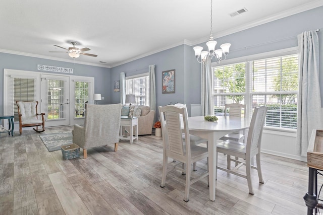 314 Black Oak Ln Unit 102, Murrells Inlet, SC 29576 - dining space featuring light wood finished floors, a chandelier, ceiling fan, and crown molding