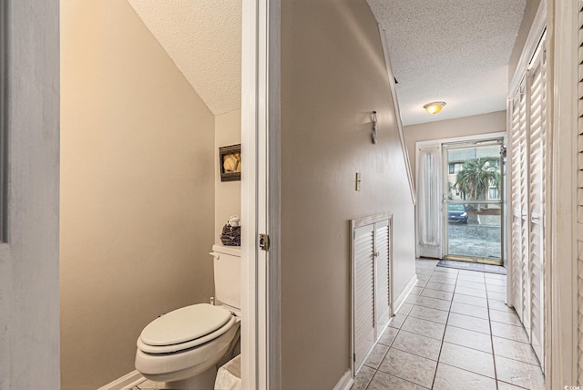 951 Plantation Dr Unit F1, Little River, SC 29566 - hallway with a textured ceiling and light tile patterned floors