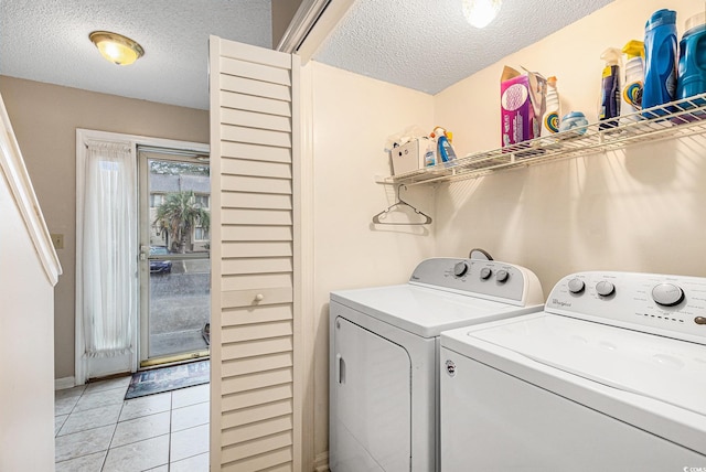 951 Plantation Dr Unit F1, Little River, SC 29566 - washroom with washer and dryer, a textured ceiling, and light tile patterned floors