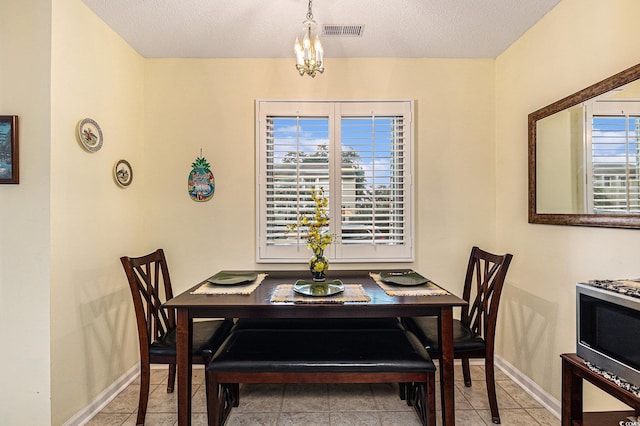 951 Plantation Dr Unit F1, Little River, SC 29566 - dining area with light tile patterned flooring and a textured ceiling