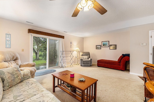951 Plantation Dr Unit F1, Little River, SC 29566 - living room with a ceiling fan, carpet, and a textured ceiling
