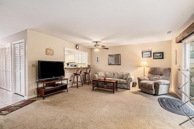 951 Plantation Dr Unit F1, Little River, SC 29566 - living room featuring light colored carpet, ceiling fan, and a textured ceiling