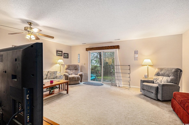 951 Plantation Dr Unit F1, Little River, SC 29566 - living room featuring carpet, a ceiling fan, and a textured ceiling