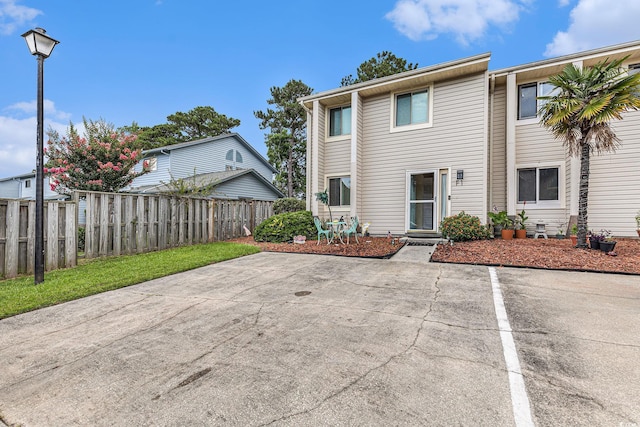 951 Plantation Dr Unit F1, Little River, SC 29566 - view of front of home featuring a patio area and uncovered parking