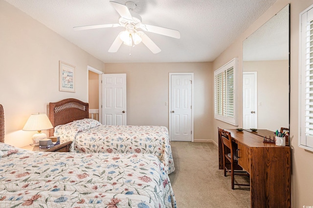 951 Plantation Dr Unit F1, Little River, SC 29566 - carpeted bedroom featuring multiple windows, ceiling fan, and a textured ceiling