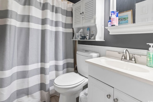 1710-C Edge Dr, North Myrtle Beach, SC 29582 - bathroom featuring vanity, wainscoting, curtained shower, and tile patterned flooring