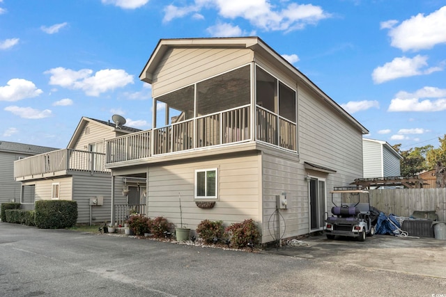 1710-C Edge Dr, North Myrtle Beach, SC 29582 - view of home's exterior featuring a sunroom
