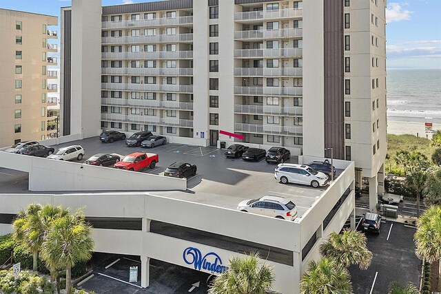 523 S Ocean Blvd Unit 305, North Myrtle Beach, SC 29582 - view of apartment building / complex with uncovered parking and a water view
