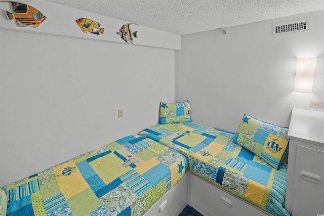 523 S Ocean Blvd Unit 305, North Myrtle Beach, SC 29582 - bedroom with a textured ceiling