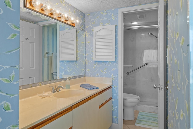 523 S Ocean Blvd Unit 305, North Myrtle Beach, SC 29582 - bathroom featuring wallpapered walls, vanity, a textured ceiling, a shower stall, and tile patterned flooring